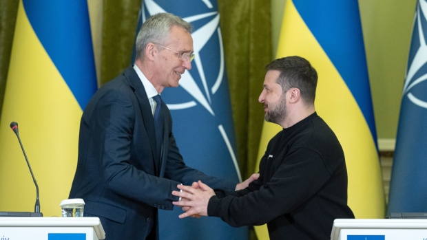 Jens Stoltenberg, secretary general of the North Atlantic Treaty Organization (NATO), left, shakes hands with Volodymyr Zelenskiy, Ukraine's president, at a news conference in Kyiv, Ukraine, on Thursday, April 20, 2023. The US is opposing efforts by some European nations to offer Ukraine a clear “road map” to NATO membership at the alliance’s July summit in Lithuania, the Financial Times reported, citing four officials involved in the talks.