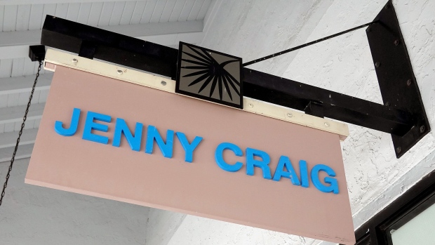 MIAMI, FLORIDA - APRIL 28: A Jenny Craig sign hangs on the wall outside of the weight loss store on April 28, 2023 in Miami, Florida. Reports indicate that the Jenny Craig company will undergo potential mass layoffs as it begins a hunt for a buyer. (Photo by Joe Raedle/Getty Images)