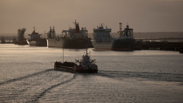 SOUTHAMPTON, ENGLAND - JANUARY 07: Tankers are berthed besides the Fawley oil refinery and Hamble oil terminal on January 7, 2015 in Southampton, England. The price of unleaded petrol has fallen to its lowest levels for five years prompting some analysts to predict that it may go as low as £1 a litre. (Photo by Matt Cardy/Getty Images)