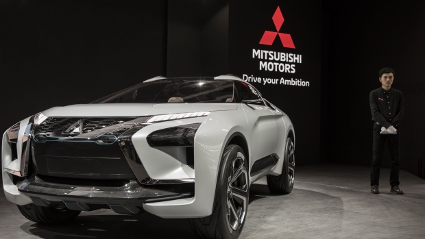 A Mitsubishi Motors Corp. e-Evolution concept sports utility vehicle (SUV) stands on display at the Beijing International Automotive Exhibition in Beijing, China, on Thursday, April 26, 2018. The Exhibition is a barometer of the state of the world’s biggest passenger-vehicle market. Photographer: Qilai Shen/Bloomberg