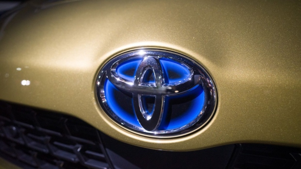 A Toyota Motor Corp. logo on a vehicle at a dealership in Sapporo, Japan, on Wednesday, Aug. 3, 2022. Toyota Motor is scheduled to release its earnings figures on Aug. 4. Photographer: Kentaro Takahashi/Bloomberg