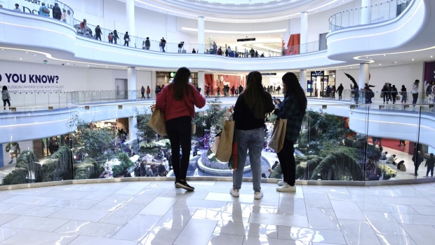 EAST RUTHERFORD, NJ - NOVEMBER 25: Women carry shopping bags as customers visit the American Mall dream mall during Black Friday on November 25, 2022 in East Rutherford, New Jersey. Black Friday, the day after Thanksgiving, is traditionally regarded as the start of the holiday shopping season, with shoppers flocking to stores and online for bargains, but with consumer confidence down, retailers are bracing for a considerably slower Black Friday. (Photo by Kena Betancur/Getty Images)