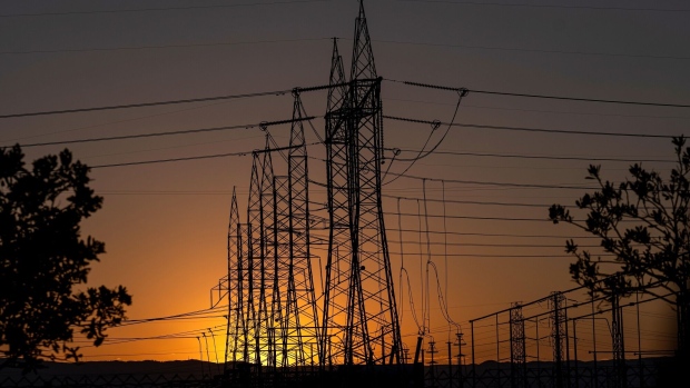 Electrical transmission towers at a Pacific Gas and Electric (PG&E) electrical substation during a heatwave in Vacaville, California, US, on Tuesday, Sept. 6, 2022. California narrowly avoided blackouts for a second successive day even as blistering temperatures pushed electricity demand to a record and stretched the state's power grid close to its limits.