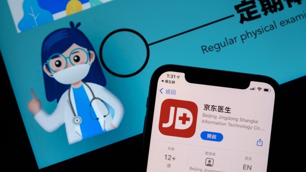 The app download page for JD Doctor, operated by JD.Com Inc.'s JD Health International Inc., arranged on a smartphone in Hong Kong, China, on Sunday, Dec. 6, 2020. JD Health raised HK$27 billion ($3.5 billion) after pricing Asia’s biggest health-care initial public offering at the top end of a marketed range. Photographer: Roy Liu/Bloomberg