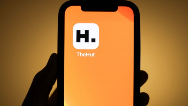 THG Plc's The Hut app on a mobile phone arranged in London, U.K., on Friday, Jan. 28, 2022. THG Plc warned that profitability missed analysts' estimates and said sales growth will decelerate this year amid high prices for protein shake ingredients and continued uncertainty from the pandemic.