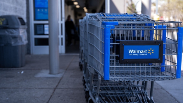 Shopping carts outside a Walmart in Chicago. Photographer: Christopher Dilts/Bloomberg