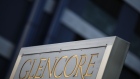 Signage stands near the Glencore Plc headquarters office in Baar, Switzerland, on Friday, July 6, 2018. Glencore will buy back as much as $1 billion of its shares, a move that may soothe investor concerns after the worlds top commodity trader was hit by a U.S. Department of Justice probe earlier this week. Photographer: Stefan Wermuth/Bloomberg