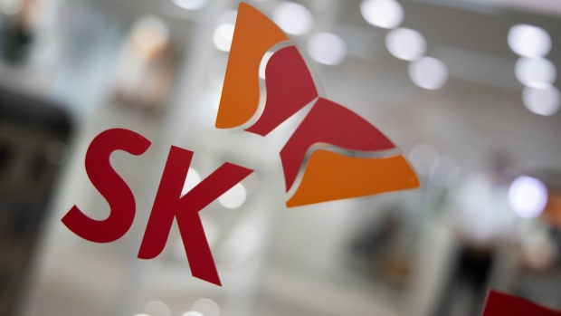 Signage for SK Group is displayed at the entrance to the company's office in Seongnam, South Korea, on Monday, July 22, 2019. SK Hynix is scheduled to release earnings figures on July 25. Photographer: SeongJoon Cho/Bloomberg