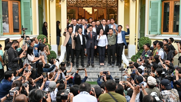 Pita Limjaroenrat, leader of the Move Forward Party, center, speaks to members of the media following a meeting with coalition partners in Bangkok, Thailand, on Wednesday, May 17, 2023. Thailand’s Move Forward Party, which has staked claim to lead a government after emerging as the single-largest party in Sunday’s election, held talks with its coalition partners as it struggles to win enough support from the influential Senate. Photographer: James Wilson/Bloomberg