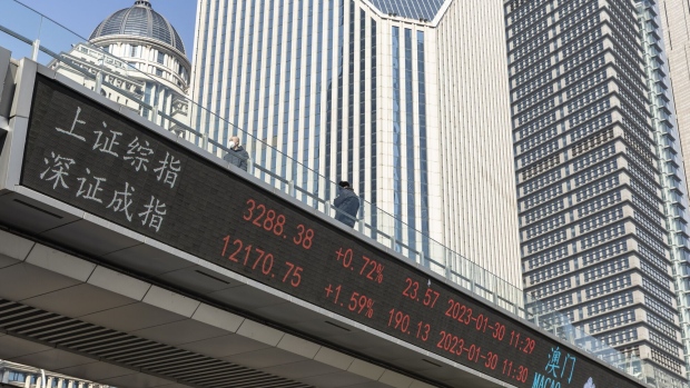 The Shanghai Composite Index and the Shenzhen Component Index displayed on a stock ticker in Pudong's Lujiazui Financial District in Shanghai, China, on Monday, Jan. 30, 2023. China's stocks pulled back from the verge of a bull market, with the muted reopening from a week-long Lunar New Year break indicating that traders are waiting on new catalysts. Photographer: Qilai Shen/Bloomberg