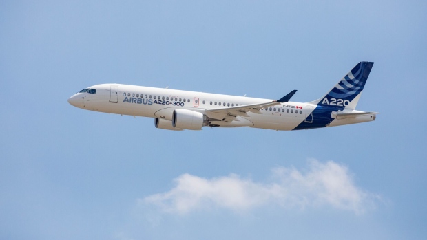 A new Airbus A220 single-aisle aircraft comes in to land in Toulouse, France, on Tuesday, July 10, 2018. Airbus renamed the C Series jet acquired from Bombardier Inc. the A220 and set a target of at least 100 orders for the aircraft this year.