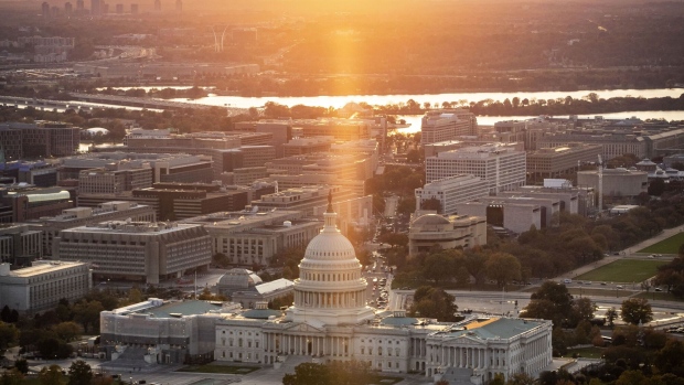 The U.S. Capitol is seen at dusk in this aerial photograph taken above Washington, D.C., U.S., on Tuesday, Nov. 4, 2019. Democrats and Republicans are at odds over whether to provide new funding for Trump's signature border wall, as well as the duration of a stopgap measure. Some lawmakers proposed delaying spending decisions by a few weeks, while others advocated for a funding bill to last though February or March. Photographer: Al Drago/Bloomberg