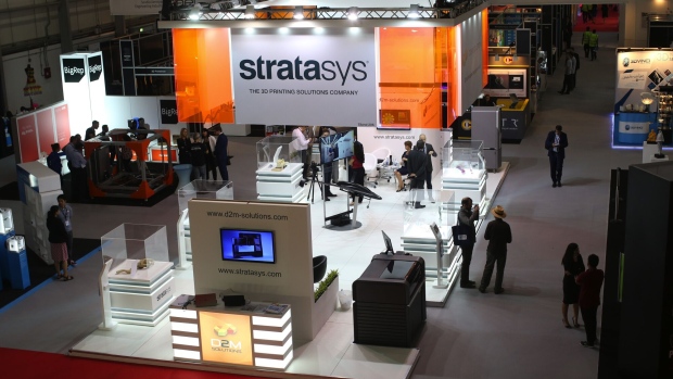 Dones and aviation parts manufactured by 3-D printing technology sit on display at the Stratasys Ltd. stand in the exhibition hall on the opening day of the 14th Dubai Air Show at Dubai World Central (DWC) in Dubai, United Arab Emirates, on Sunday, Nov. 8, 2015. The Dubai Air Show is the biggest aerospace event in the Middle East, Asia and Africa and runs Nov. 8 - 12.