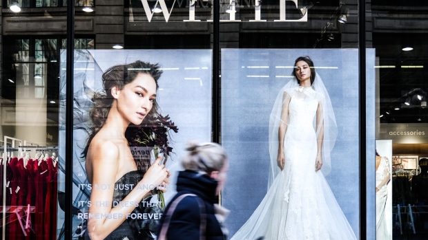 A pedestrian passes in front of a David's Bridal Inc. store in New York, U.S., on Wednesday, Nov. 14, 2018. David’s Bridal Inc. is nearing an agreement with lenders to cut debt through a bankruptcy filing and keep its chain of wedding-gown stores in business, according to people with knowledge of the matter.