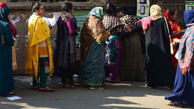 Voters wait in line outside a polling station in Dhaka, Bangladesh, in 2018. Photographer: Munir Uz Zaman/Getty Images