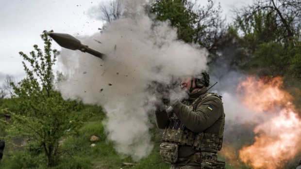 An Ukrainian soldier fires a rocket gun in the Donetsk region. Photographer: Muhammed Enes Yildirim/Anadolu Agency/Getty Images