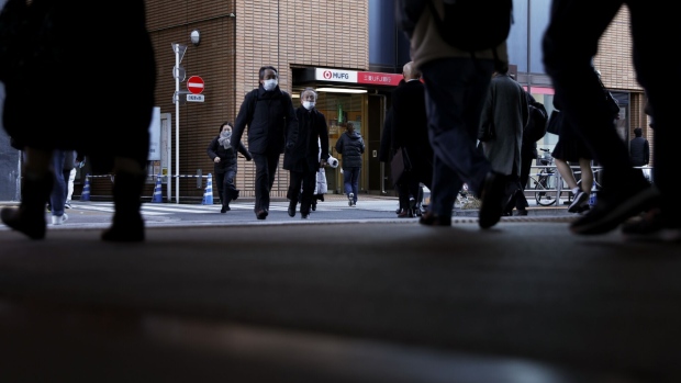 Pedestrians in front of a branch of MUFG Bank Ltd., a unit of Mitsubishi UFJ Financial Group Inc. (MUFG), in Tokyo, Japan, on Wednesday, Jan. 25, 2023. Japan's mega banks are scheduled to release its third-quarter earnings figures next week. Photographer: Kiyoshi Ota/Bloomberg