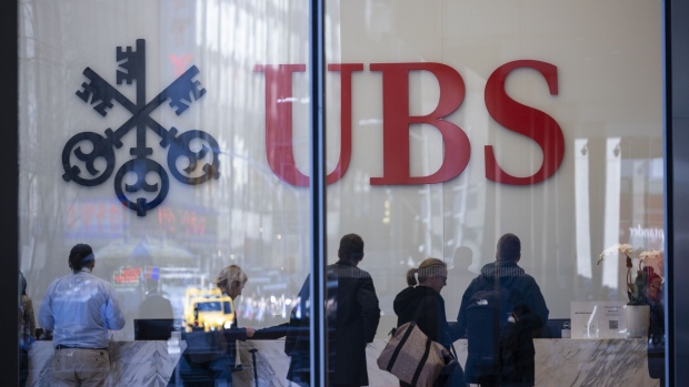 Signage at the UBS flagship office in New York, US, on Tuesday, March 21, 2023. UBS Group AG jumped as much as 10%, on track for its biggest gain since March 2020, as investor optimism about the takeover of its largest rival gathered pace.