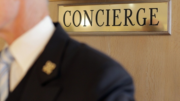A concierge of a luxury hotel in Cannes, southeastern France. Photographer: Jean Christophe Magnenet/AFP/Getty Images