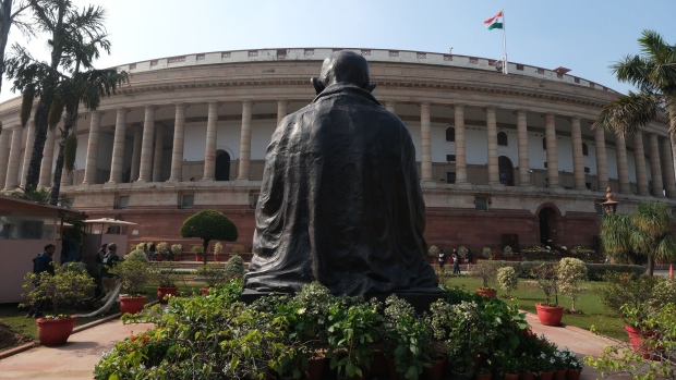 Statue of Mahatma Gandhi at the current parliament building in New Delhi in January.