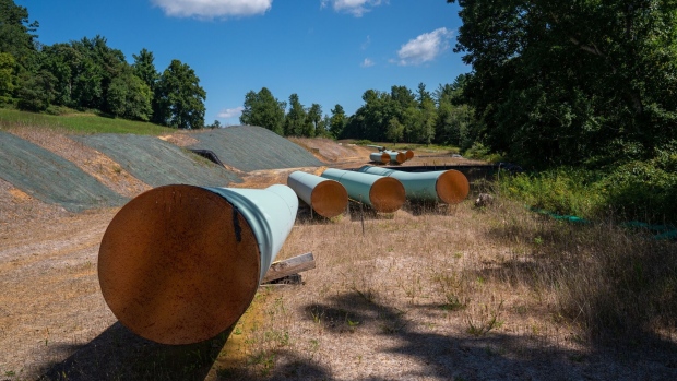 BENT MOUNTAIN, VIRGINIA - AUGUST 31: Sections of 42 diameter sections of steel pipe of the Mountain Valley Pipeline, MVP, lie on wooden blocks, August 31, 2022 in Bent Mountain, Virginia. The MVP will transport natural gas through 303 miles of West Virginia and Virginia. Public opposition has centered on challenging MVPs permitting through wetlands and national forests. The original budget of $3.5 billion is now estimated to be $6.2 billion. The Federal Energy Regulatory Control agency, FERC, has recently granted MVP another 4-years to complete. (Photo by Robert Nickelsberg/Getty Images)
