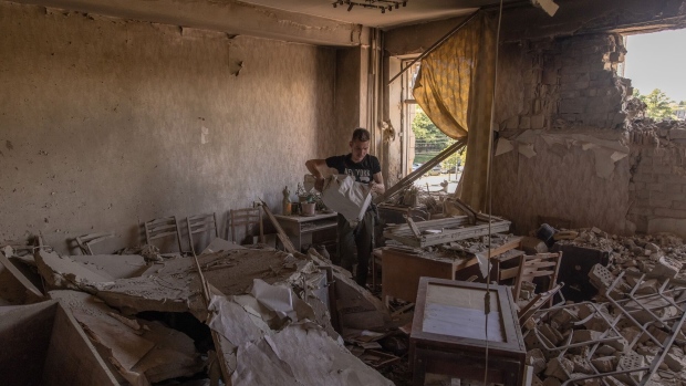 KYIV, UKRAINE - MAY 28: A man clears debris in a building damaged during a Russian drone attack on May 28, 2023 in Kyiv, Ukraine. According to Ukrainian Air Forces, it had intercepted 52 out of 54 Iranian-made drones Shahed-136 launched by Russia targeting Ukraine. Over 40 drones were shot down over the capital Kyiv, with at least one person killed, and another injured. It was Russia's biggest air attack on Kyiv since the beginning of the war. (Photo by Roman Pilipey/Getty Images)