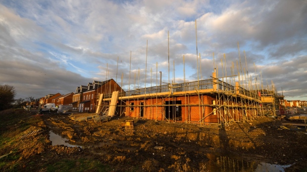 Scaffolding surrounds a home under construction at a Persimmon Plc residential property construction site in Northfleet, UK, on Monday, Jan. 9, 2023. Persimmon’s fourth quarter sales and revenue update on Thursday, will be closely watched for any impact on selling prices in the final quarter of 2022.