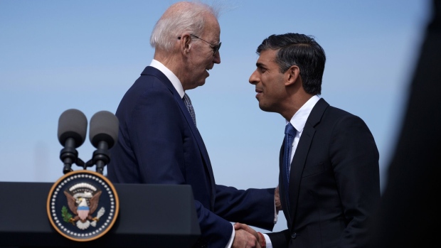 US President Joe Biden, left, and Rishi Sunak, UK prime minister, shake hands at Naval Base Point Loma in San Diego, California, US, on Monday, March 13, 2023. The prime ministers of the UK and Australia are meeting Biden today as the three nations unveil the next phase of the AUKUS nuclear submarine program, a security partnership meant to counter China.