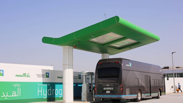 A hydrogen-powered bus stops to demonstrate refueling at the newly opened hydrogen fueling station, operated by Saudi Aramco, in the Air Products New Technology Center in Dhahran, Saudi Arabia, on Sunday, June 27, 2021. Saudi Aramco outlined plans to invest in blue hydrogen as the world shifts away from dirtier forms of energy, but said it will take at least until the end of this decade before a global market for the fuel is developed.
