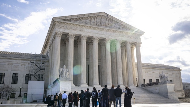 WASHINGTON, DC - FEBRUARY 21: People wait in line to listen to oral arguments at the U.S. Supreme Court on February 21, 2023 in Washington, DC. Oral arguments are taking place today in Gonzalez v. Google, a landmark case about whether technology companies should be liable for harmful content their algorithms promote. (Photo by Drew Angerer/Getty Images)