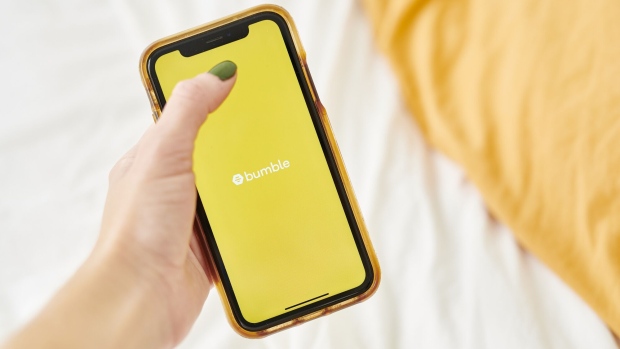 The logo for Bumble is displayed on a smartphone in an arranged photograph taken in the Brooklyn borough of New York, U.S., on Friday, Oct. 9, 2020. Blackstone Group, which bought a majority stake in the owner of dating app Bumble last year when it was known as MagicLab, is now seeking a payout from a $200 million loan. Photographer: Gabby Jones/Bloomberg