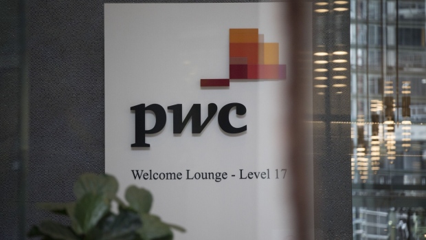 Signage at the lobby of PricewaterhouseCoopers Australia office in Sydney, Australia, on Thursday, May 25, 2023. The Australian government has referred a PwC tax scandal to the police and asked them to consider a criminal investigation as political scrutiny mounts. Photographer: Brent Lewin/Bloomberg