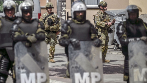 NATO peacekeers and military police in Zvecan, northern Kosovo on May 30. Photographer: Armend Nimania/AFP/Getty Images