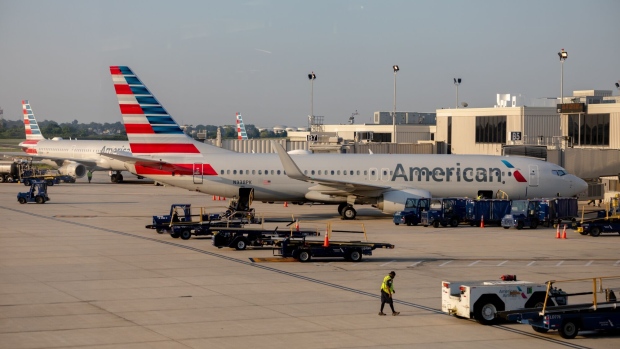American Airlines planes at a gate of Philadelphia International Airport (PHL) in Philadelphia, Pennsylvania, U.S., on Friday, Aug. 6, 2021. Citing a surge in unruly passengers, U.S. aviation regulators are calling on the nation's airports to encourage the police to arrest offenders, and to prevent people from sneaking alcohol on board.