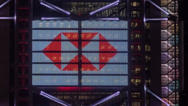 The HSBC Holdings Plc logo is displayed on the facade of the company's headquarters in Hong Kong, China, on Friday, Feb. 18, 2022. HSBC is scheduled to release earnings results on Feb. 22. Photographer: Paul Yeung/Bloomberg