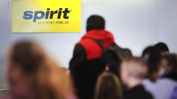 CHICAGO, ILLINOIS - APRIL 06: Passengers wait for their luggage after arriving on a Spirit Airlines flight at O'Hare International Airport on April 06, 2022 in Chicago, Illinois. JetBlue Airways has made an offer to buy Spirit Airlines for $3.6 billion. (Photo by Scott Olson/Getty Images)