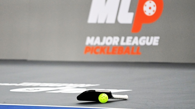 COLUMBUS, OHIO - OCTOBER 15: A pickleball and paddle lay on the court during a quarterfinals Major League Pickleball match between Clean Cause and Mad Drops Pickleball Club at Pickle & Chill on October 15, 2022 in Columbus, Ohio. (Photo by Emilee Chinn/Getty Images)