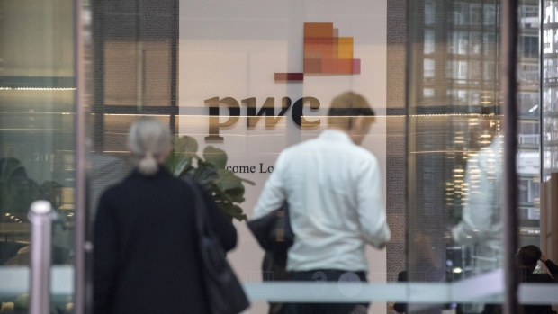 Signage at the lobby of PricewaterhouseCoopers Australia office in Sydney, Australia, on Thursday, May 25, 2023. The Australian government has referred a PwC tax scandal to the police and asked them to consider a criminal investigation as political scrutiny mounts.