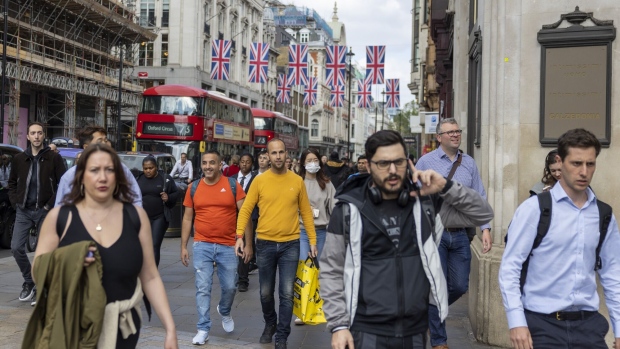 Shoppers on Oxford Street in London, UK, on Thursday, May 25, 2023. UK retailers saw sales jump more than expected last month, recovering from heavy rain that kept people home the month before.