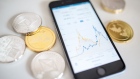 LONDON, ENGLAND - APRIL 25: In this photo illustration of the litecoin, ripple and ethereum cryptocurrency 'altcoins' sit arranged for a photograph beside a smartphone displaying the current price chart for ethereum on April 25, 2018 in London, England. Cryptocurrency markets began to recover this month following a massive crash during the first quarter of 2018, seeing more than $550 billion wiped from the total market capitalisation. (Photo by Jack Taylor/Getty Images)