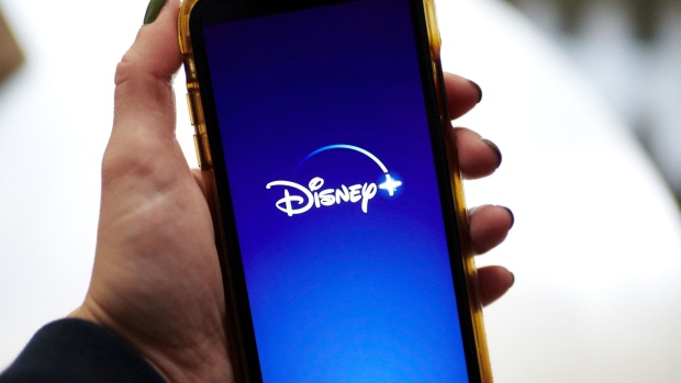 The Disney+ logo on a smartphone arranged in New York, U.S., on Wednesday, Nov. 18, 2020. Though the entertainment titan is still reeling from the pandemic, the growth of Disney+ has softened the blow. Photographer: Gabby Jones/Bloomberg