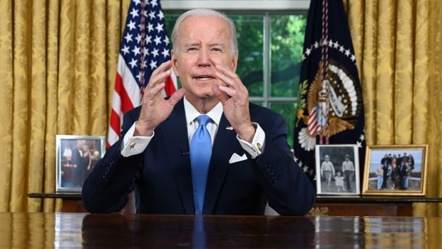 US President Joe Biden during a national address in the Oval Office of the White House in Washington, DC, US, on Friday, June 2, 2023. Biden defended a debt limit deal he struck with Republicans as necessary to prevent an “economic collapse” and said he would sign it on Saturday amid frustration from many lawmakers in both parties who backed the agreement reluctantly. Photographer: Jim Watson/AFP/Bloomberg