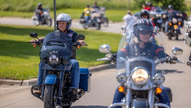 Former Vice President Mike Pence riding a motorcycle during the Roast and Ride.