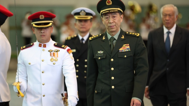 Li Shangfu, China's defense minister, inspects an honor guard in Singapore, on Thursday, June 1, 2023. The US had proposed in May that Secretary of Defense Lloyd Austin meet his counterpart Li Shangfu in Singapore during the Shangri-La Dialogue, a marquee Asia-Pacific security gathering. Photographer: Lionel Ng/Bloomberg
