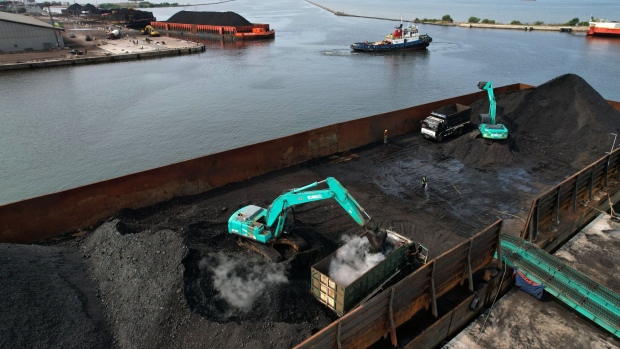Coal on a barge loaded onto trucks at Cirebon Port in West Java, Indonesia, on Wednesday, May 11, 2022. Trade has been a bright spot for Indonesia, which has served as a key exporter of coal, palm oil and minerals amid a global shortage in commodities after Russia’s invasion of Ukraine.