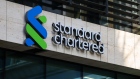 A Standard Chartered Plc logo at their headquarters in London, UK, on Thursday, Feb. 9, 2023. First Abu Dhabi Bank PJSC is pressing ahead with a potential offer for Standard Chartered Plc, after a move to put earlier takeover plans on hold didn’t halt its ambitions to become a global financial powerhouse. Photographer: Hollie Adams/Bloomberg