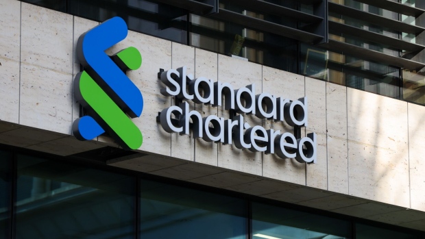 A Standard Chartered Plc logo at their headquarters in London, UK, on Thursday, Feb. 9, 2023. First Abu Dhabi Bank PJSC is pressing ahead with a potential offer for Standard Chartered Plc, after a move to put earlier takeover plans on hold didn’t halt its ambitions to become a global financial powerhouse. Photographer: Hollie Adams/Bloomberg