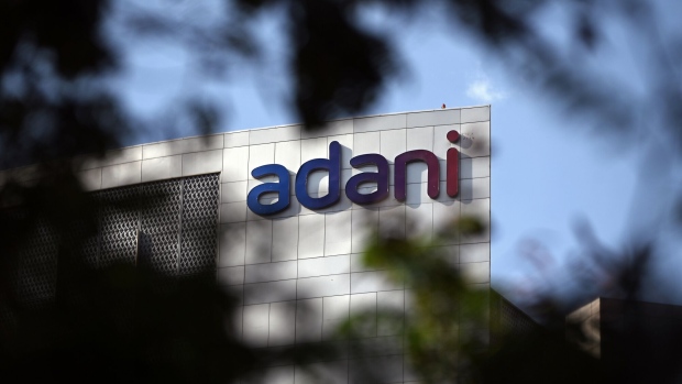 Signage atop the Adani Group headquarters in Ahmedabad, India, on Wednesday, March 8, 2023. A meeting was held in London Wednesday, as a part of a worldwide roadshow aimed at reassuring international investors that the ports-to-power empire’s finances are under control, after as much as $153 billion in combined market value was erased from company stocks following a January short seller’s report.