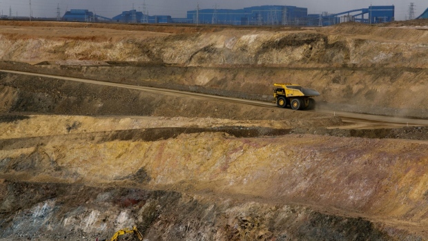 KHANBOGD-SOUTH GOBI DESERT, MONGOLIA - OCTOBER 11: Trucks move tons of ore at the open pit mining area at the Oyu Tolgoi mine October 11, 2012 in the south Gobi desert, Khanbogd region, Mongolia. 