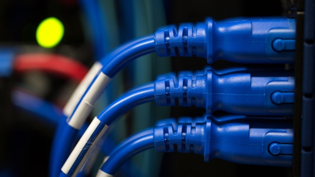 Blue power cables connect devices in the server room of the Sberbank PJSC data processing center (DPC) at the Skolkovo Innovation Center, in Moscow, Russia, on Tuesday, Dec. 26, 2017. Sberbank PJSC, Russia’s most valuable company, will boost its dividend payout to 50 percent of profit or higher, just not as quickly as some investors had hoped. Photographer: Andrey Rudakov/Bloomberg